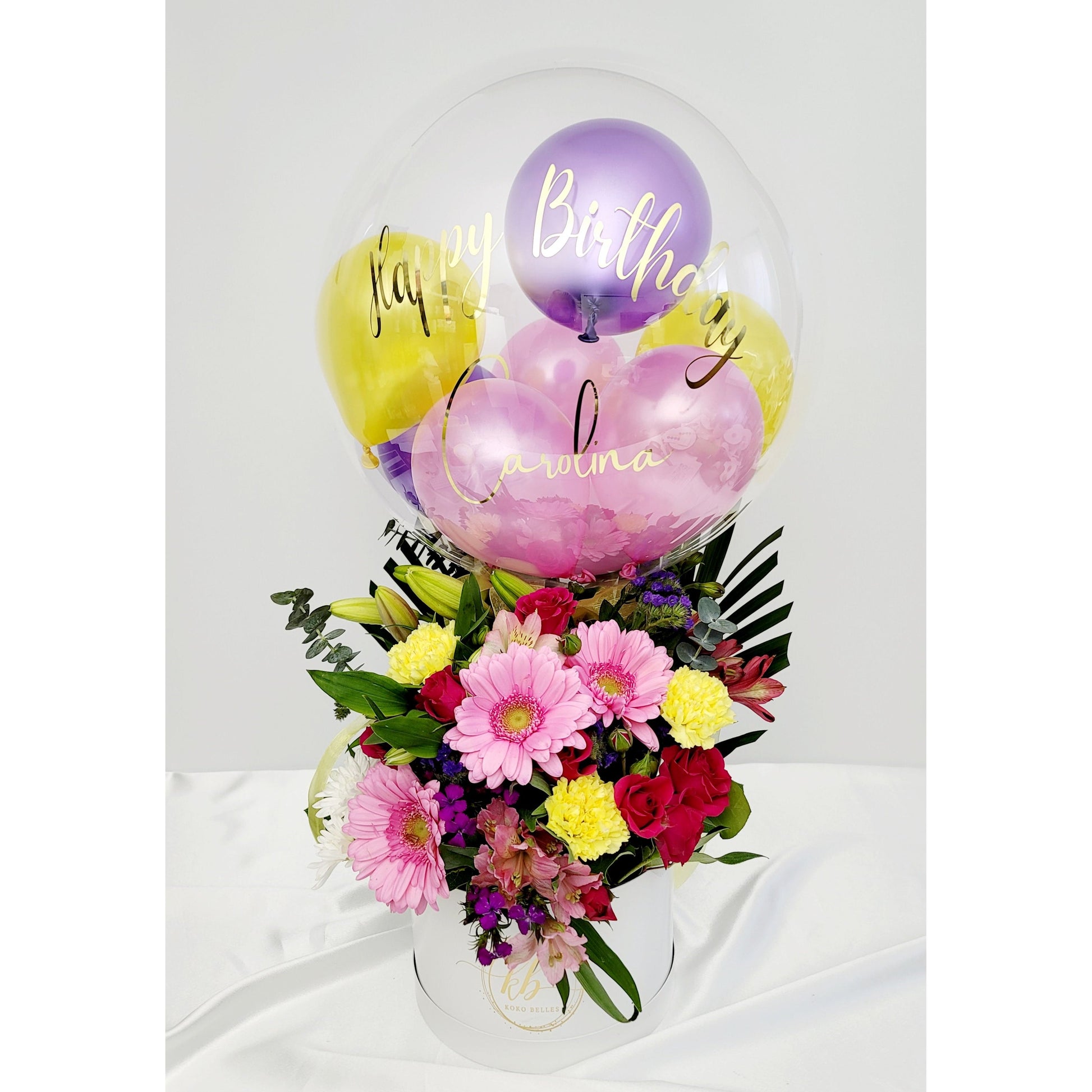 Elevated floral elegance. Take your traditional floral bouquet to the next level with a customized hot air balloon arrangement.